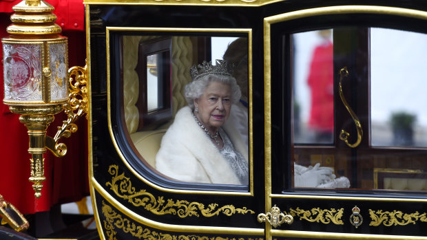 The Queen on her way to reopen British Parliament. 