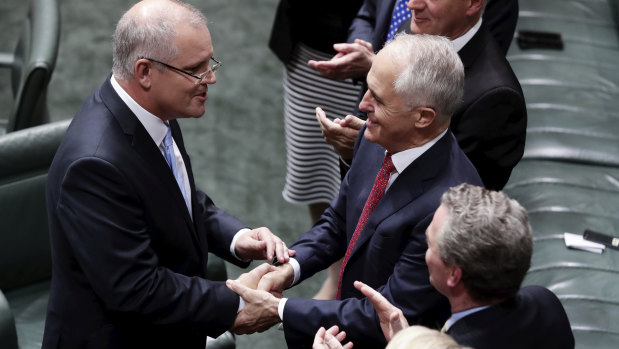 Treasurer Scott Morrison is congratulated by Prime Minister Malcolm Turnbull after delivering the Budget speech.