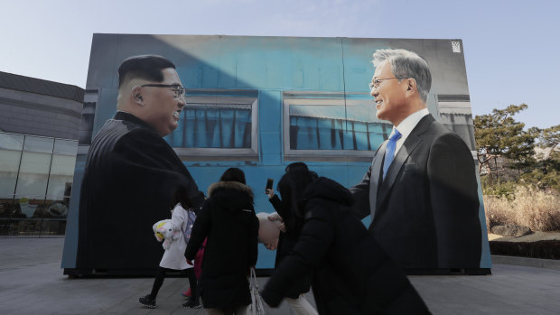 An image of North Korean leader Kim Jong-un and South Korean President Moon Jae-in displayed near the presidential Blue House in Seoul, South Korea.