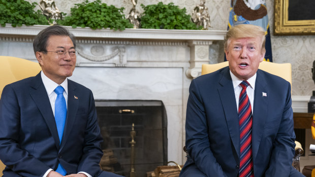US President Donald Trump speaks while Moon Jae-in, South Korea's president, left.