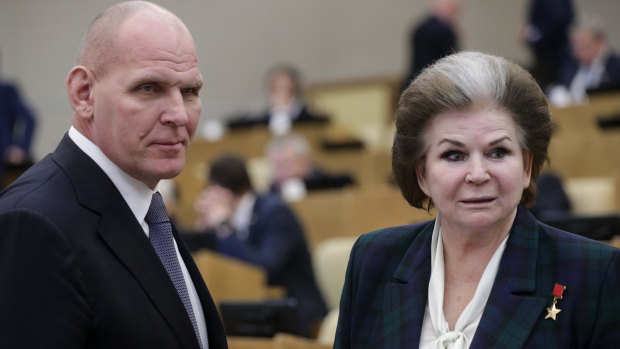 Former wrestler and lawmaker Alexander Karelin, left, and the world's first woman cosmonaut Valentina Tereshkova in the Russian lower house during a vote to extend Vladimir Putin's reign.