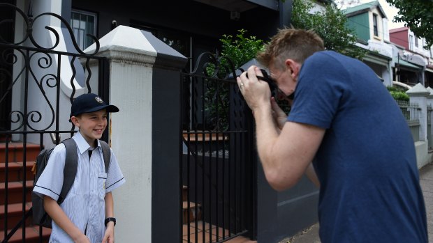Oscar Bradfield, 12, poses for first-day-of-high-school photos as he heads off to the brand new school, Inner Sydney High.