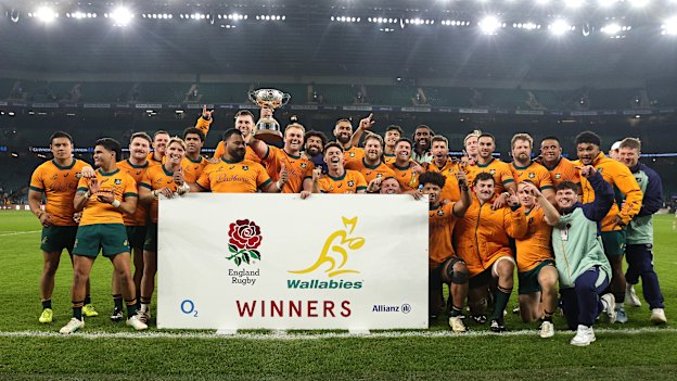 The Wallabies celebrate with the Ella Mobbs Cup after their victory.