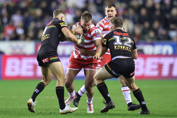 Wigan prop Mike Cooper runs the ball into the Penrith defence.