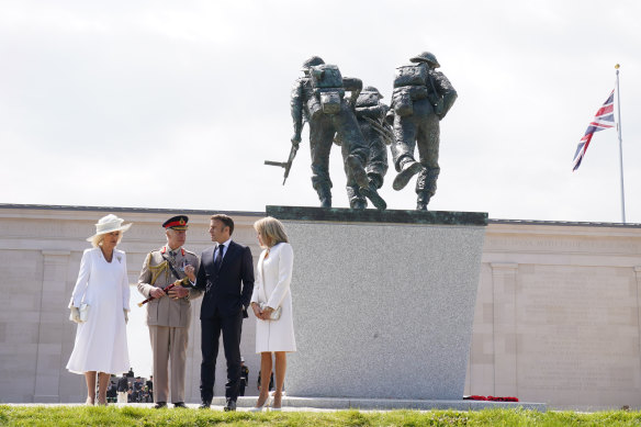 Queen Camilla with King Charles III and French President Emmanuel Macron and his wife Brigitte Macron beneath the D-Day Sculpture at the British Normandy Memorial to mark the 80th anniversary of D-Day. 