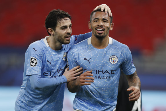 Bernardo Silva, left, celebrates with Manchester City teammate Gabriel Jesus.