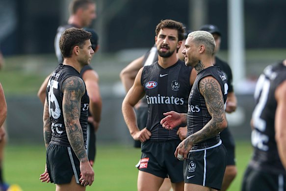 Hill chats with teammates.