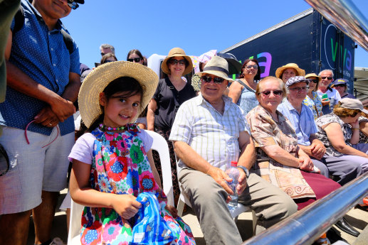 Penelope Hortense, 5, and her grandfather Dimosthenis “Tim” Gaitanis, 78 watch from Princes Pier.