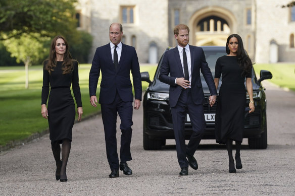 (From left), Princess Catherine, Prince William, Prince Harry and Meghan walk to meet the public after the death of Queen Elizabeth in September 2022.