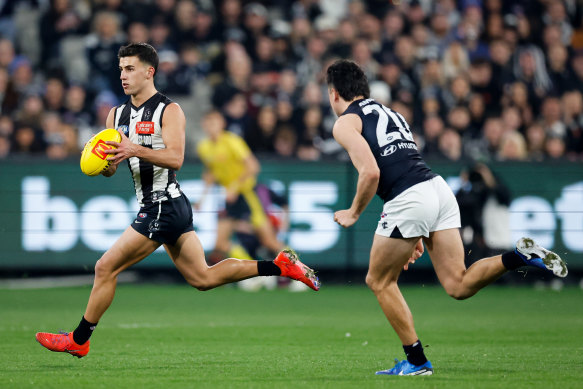 Nick Daicos of the Magpies in action.