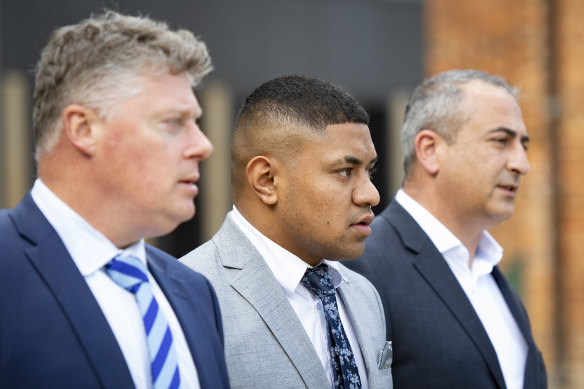 Manase Fainu (centre) is on trial in Parramatta District Court.