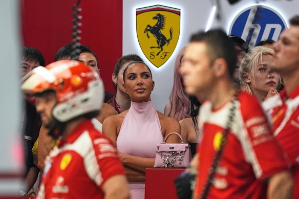 Kim Kardashian stands in the Ferrari garage