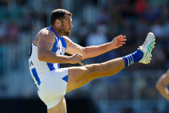 North Melbourne’s Jack Darling kicks for goal against his former side.