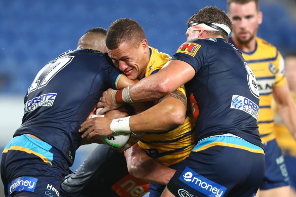Big hit... Kane Evans of the Eels during  Sunday's clash with Gold Coast. Parramatta recorded a $5.25 million loss in 2019.