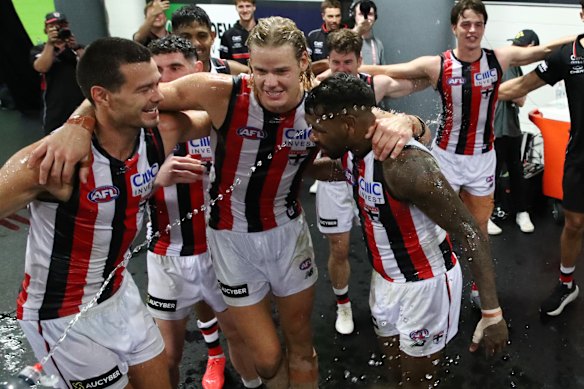 Jack Silvagni, Tom De Koning and Liam Ryan celebrate their first win as Saints.