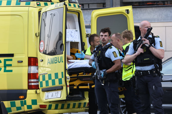 Paramedics and police outside the Field’s shopping centre in Orestad, Copenhagen.