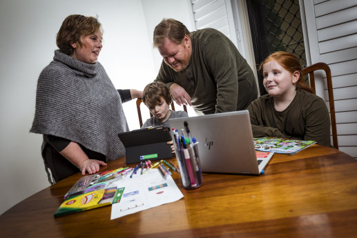 Back to school, at home: Emma Read, partner Paul Moloney and children Hugh, 7, and Bryn, 9.