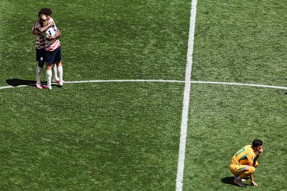 Chris Richards and Tim Ream celebrate as Australia’s Cristian Volpato kneels.