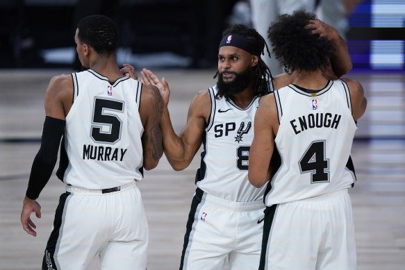 Australian Patty Mills (centre) and his Spurs have missed a spot in this year's NBA play-offs.