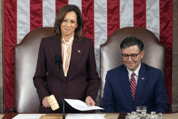 Vice President Kamala Harris reads the results next to House Speaker Mike Johnson during the joint session of Congress.