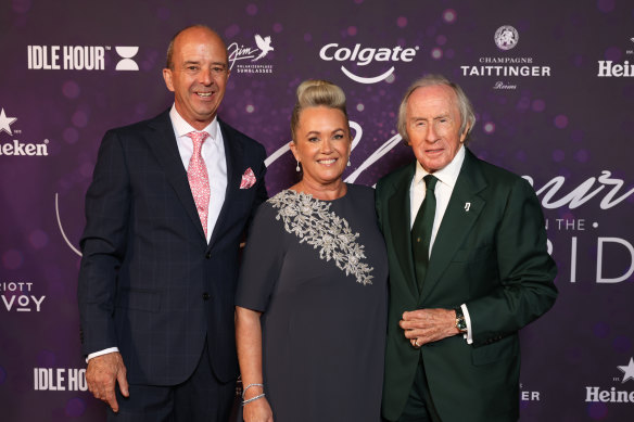 Andrew and Tina Westacott and Sir Jackie Stewart arrive at the Glamour on the Grid Party last year.