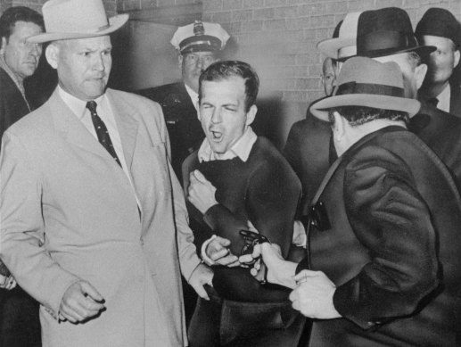 November 24, 1963: John F Kennedy’s assassin, Lee Harvey Oswald, is shot dead by Dallas nightclub owner Jack Ruby as police look on.