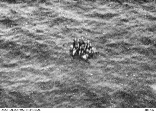 Survivors from the corvette HMAS Armidale adrift on a raft.