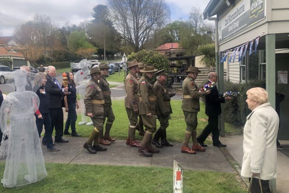 War widow Maureen Matthews watches members of the Great War Association marching to commemorate the 100th anniversary of Legacy in Korumburra, childhood town of Legacy’s founder, Lt-General Sir Stanley Savige.