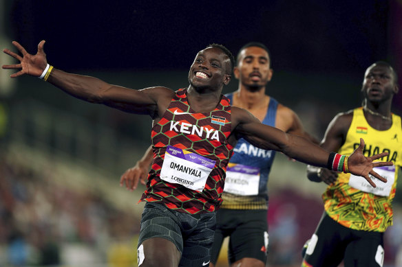 Ferdinand Omanyala celebrates his gold medal run in Birmingham.