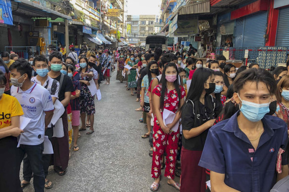 People stand in lines to get COVID-19 tests in Samut Sakhon, South of Bangkok, Thailand, on December 20, 2020. 