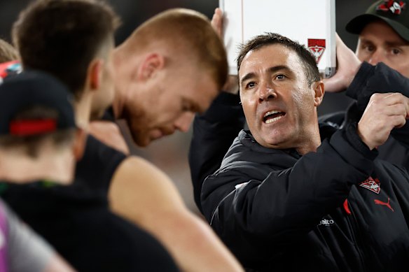 Brad Scott addresses his players during their huge defeat.