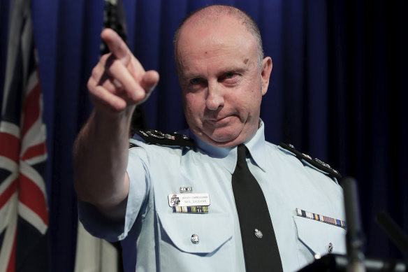 Acting Australian Federal Police commissioner Neil Gaughan addresses the media over the raids.