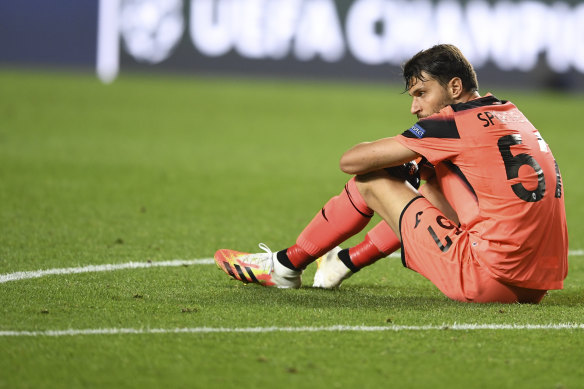 Atalanta keeper Marco Sportiello sits after the team's loss.