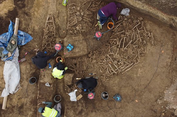 People work on the excavation of a Roman mass grave from the end of the 1st century AD, in the Simmering district of Vienna, Austria.