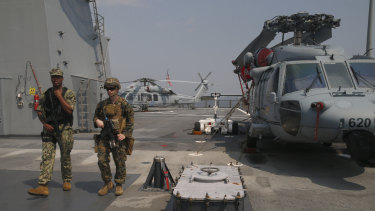USmarines patrol around the USS Blue Ridge as it anchors off Manila, Philippines. America has vowed to "sail, fly and operate wherever the law allows us to" amid China's objections in the South China Sea.