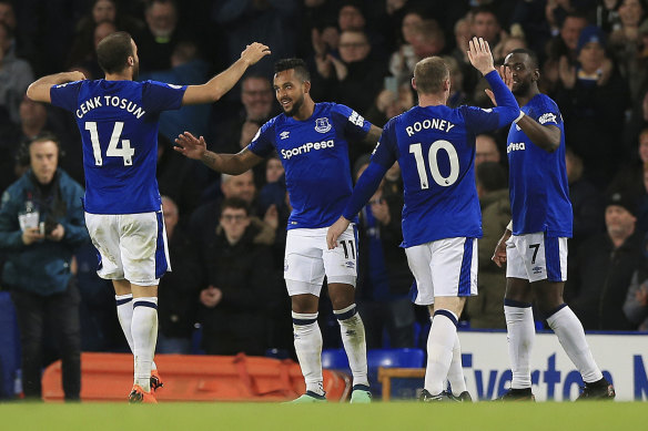 Everton celebrate Walcott's breakthrough goal.