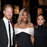 Prince Harry and Meghan, the Duchess of Sussex, pose with Serena Williams at the Baby2Baby Gala before Chris Jenna’s 70th birthday.