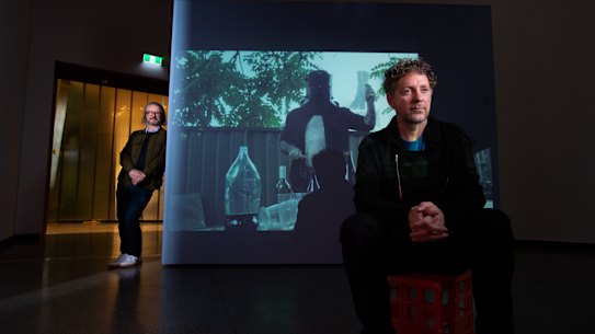 Sydney Biennale artistic director Brook Andrew (seated) and ACCA artistic director Max Delany. 