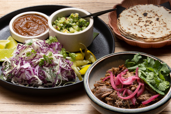 The go-to dish: falling-apart lamb barbacoa served with warm flour tortillas.