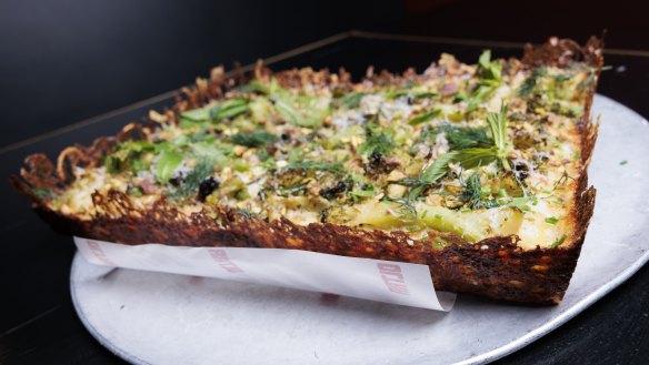 The Detroit-style Green Square pizza with a lacy, cheese edge.