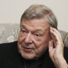 Cardinal George Pell answers' a journalists question during an interview inside his residence near the Vatican in Rome.