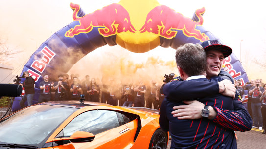 Max Verstappen embraces Red Bull team boss Christian Horner.