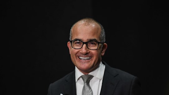 Acting Premier James Merlino smiles as he announces an easing of restrictions at Wednesday’s press conference.