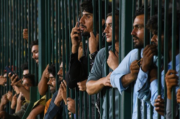 Fans cheer during the Pakistan Super League Qualifier cricket match between Peshawar Zalmi and Islamabad United, in Karachi, Pakistan.