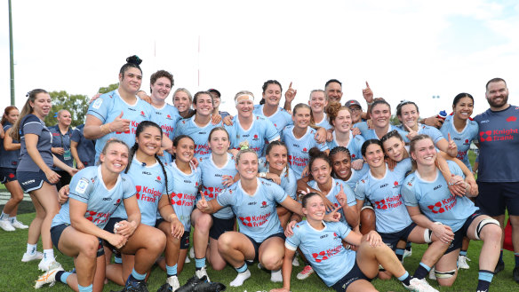The Waratahs celebrate their Super Rugby Women’s grand final victory on Sunday.
