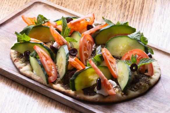 The labne manakish with zaatar, tomato, cucumber and olives.