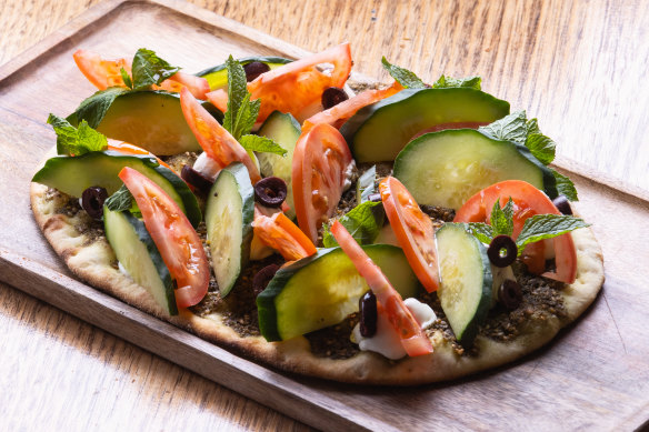 The labne manakish with zaatar, tomato, cucumber and olives.