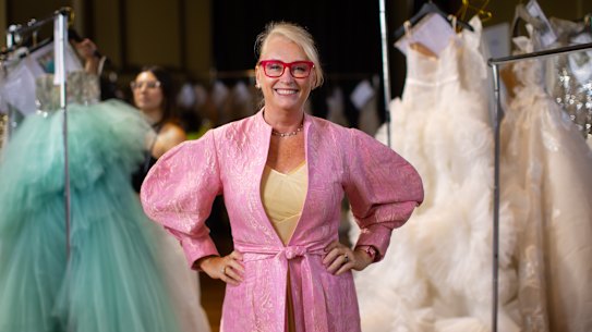 Former lord mayor Sally Capp, wearing a design by Mastani, is preparing to walk the runway in the Melbourne Fashion Festival. 