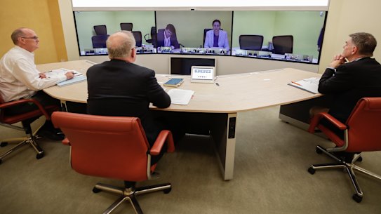 Secretary of the Department of Prime Minister and Cabinet, Phil Gaetjens, Prime Minister Scott Morrison and Chief Medical Officer Professor Brendan Murphy, speak with Queensland Premier Annastacia Palaszczuk.