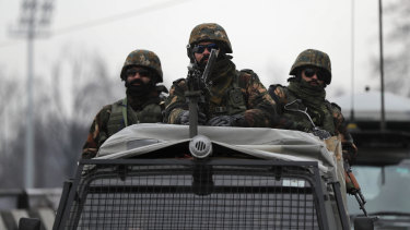 Indian army soldiers stand guard as a convoy of foreign diplomats visits Kashmir this week.